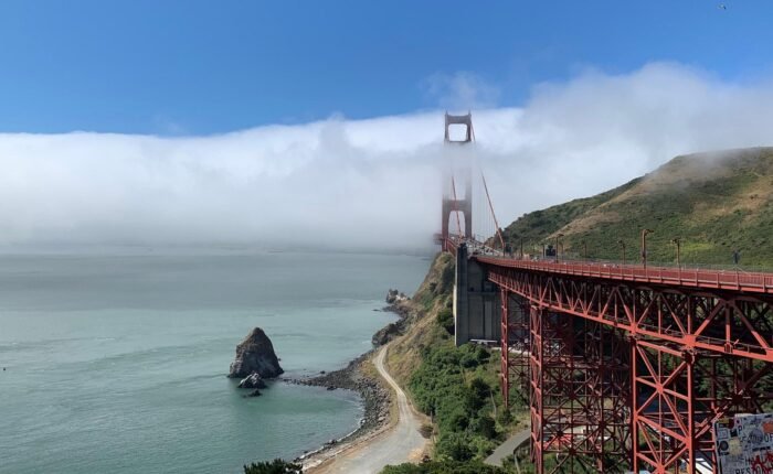 Tour van crossing Golden Gate Bridge with views of Alcatraz Island, Muir Woods redwoods, and Sausalito waterfront