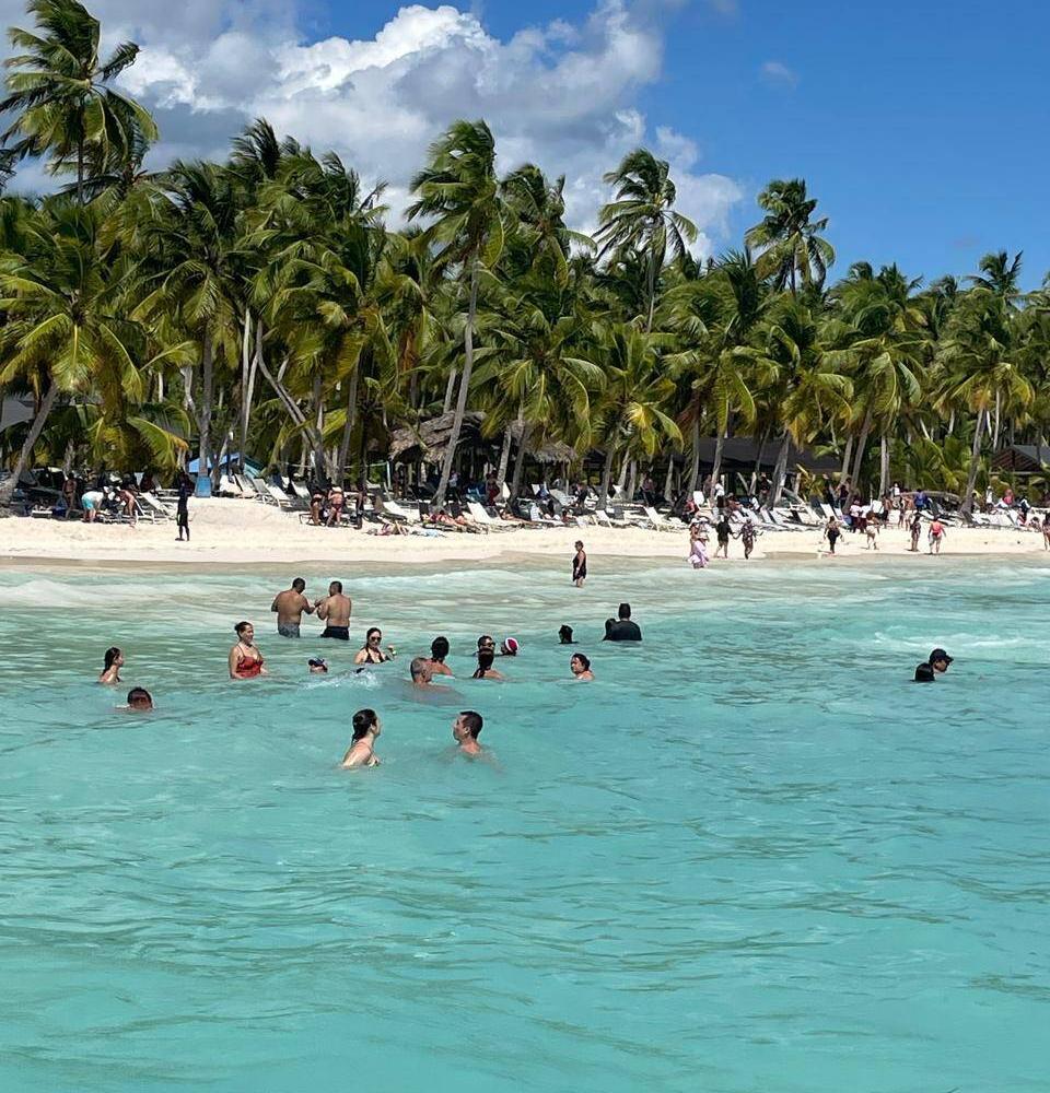 Smiling travelers enjoying a catamaran tour in Saona Island with Emilsa Tours